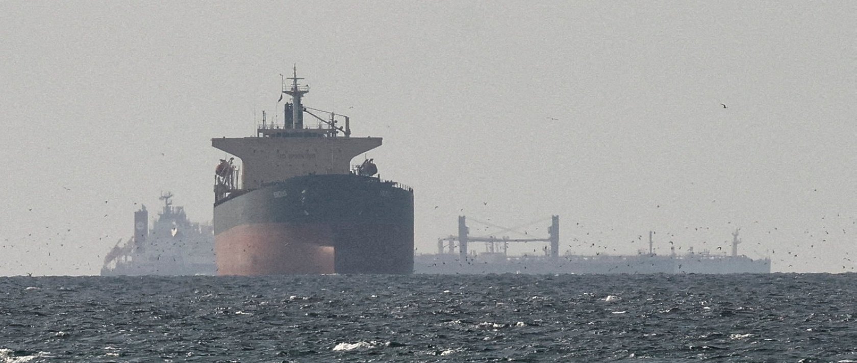 Cargo ships in the Gulf, near the Strait of Hormuz, as seen from northern Ras al-Khaimah, near the border with Oman’s Musandam governance, amid the U.S.-Israeli conflict with Iran, in United Arab Emirates, March 11, 2026. (Reuters Photo)