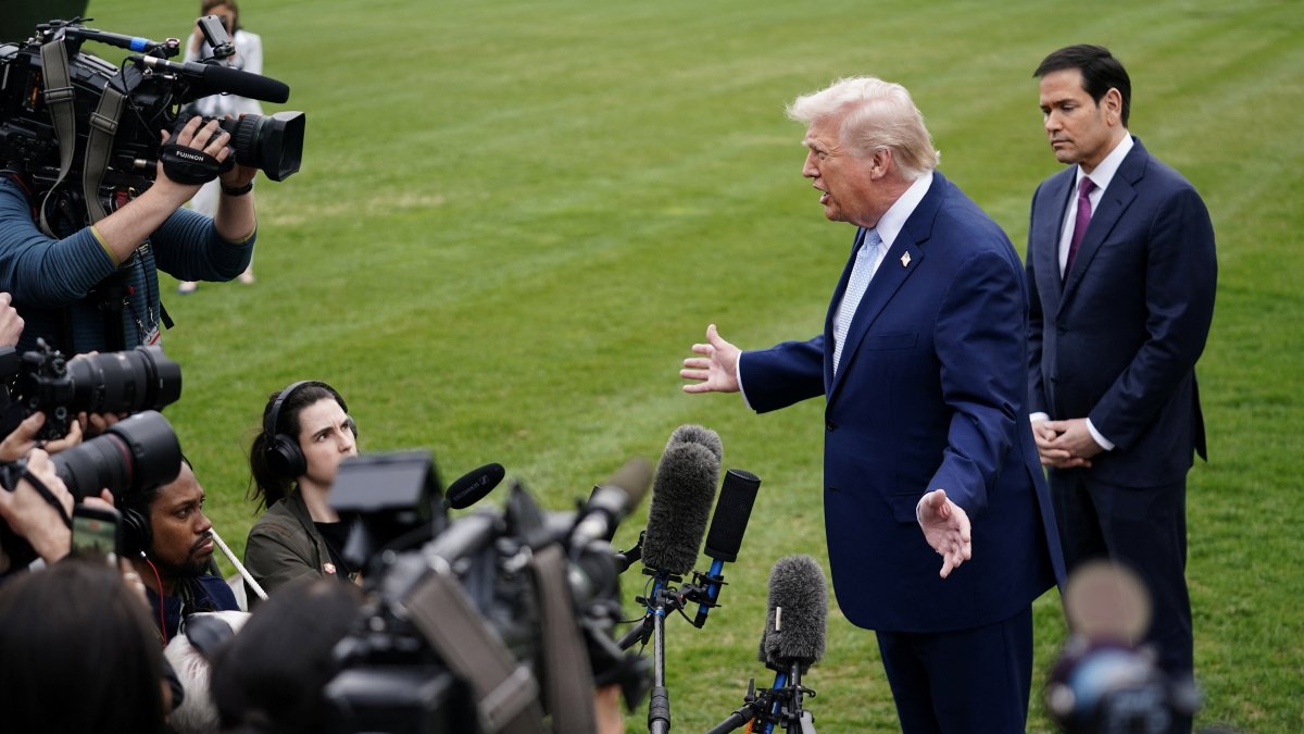 U.S. President Donald Trump speaks to the media, flanked by U.S. Secretary of State Marco Rubio, as he departs the White House for Florida, Washington, U.S., March 20, 2026. (Reuters Photo)