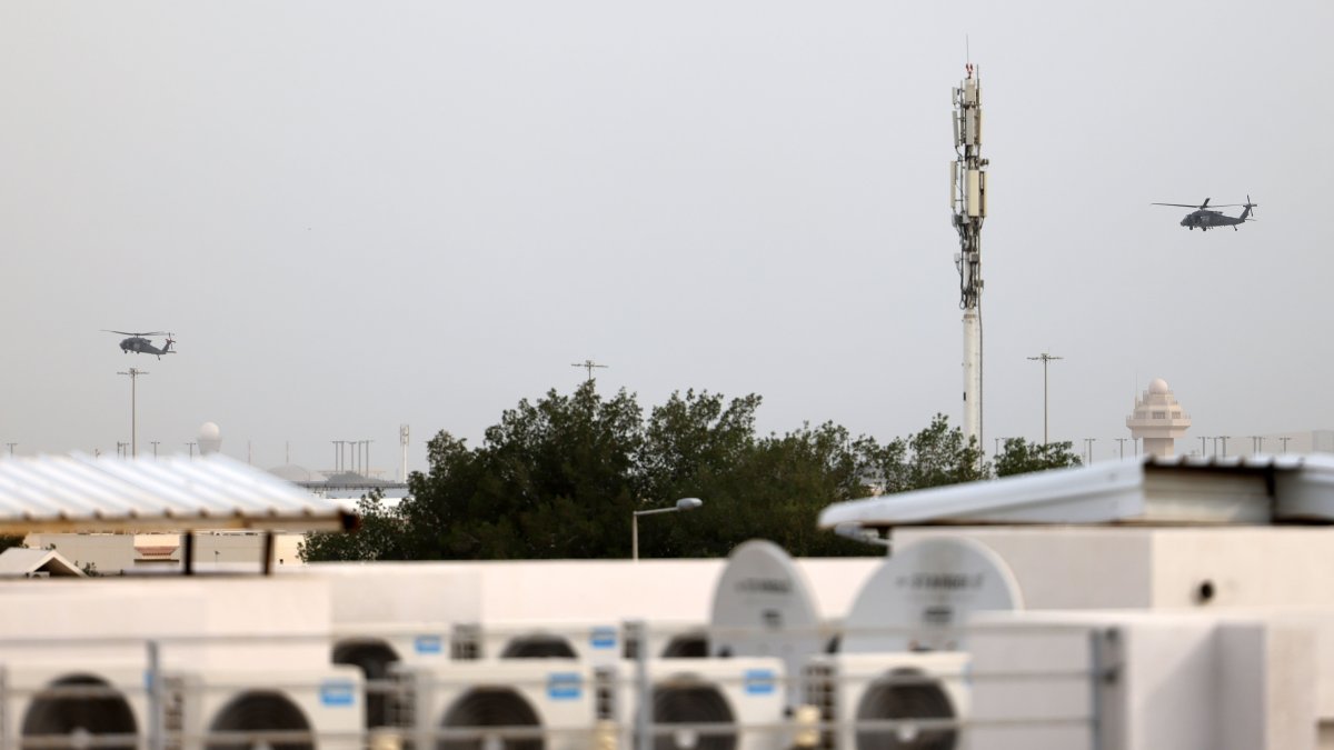This file photo shows two Qatari Air Force helicopters flying over Doha, Qatar, March 2, 2026. (Getty Images)