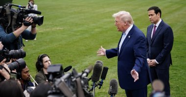 U.S. President Donald Trump speaks to the media, flanked by U.S. Secretary of State Marco Rubio, as he departs the White House for Florida, Washington, U.S., March 20, 2026. (Reuters Photo)