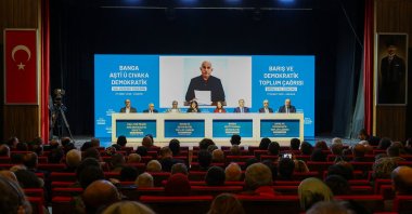 Lawmakers from a pro-PKK party attend a news conference backdropped by a picture of the PKK's jailed leader, Abdullah Öcalan, Ankara, Türkiye, Feb. 27, 2026. (Reuters Photo)