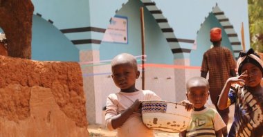 Children collect water from a clean water fountain provided by the Türkiye Diyanet Foundation (TDV), Kaduna, Nigeria, March 11, 2024. (AA Photo)