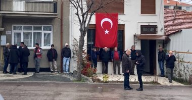 Mourners gather at Maj. Sinan Taştekin's family home in Isparta, Türkiye, March 22, 2026. (DHA Photo)