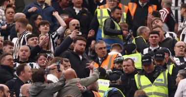 Newcastle United fans clash with police in the stands during the match against Sunderland at St. James' Park, Newcastle, U.K., March 22, 2026. (Reuters Photo) 