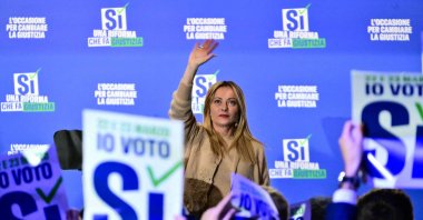 Italy's Prime Minister Giorgia Meloni waves to supporters at the end of a campaign meeting of Italian right-wing party Brothers of Italy (Fratelli d'Italia) (Fdi) to support the "Yes" to Justice referendum, Milan, Italy, March 12, 2026. (AFP Photo)