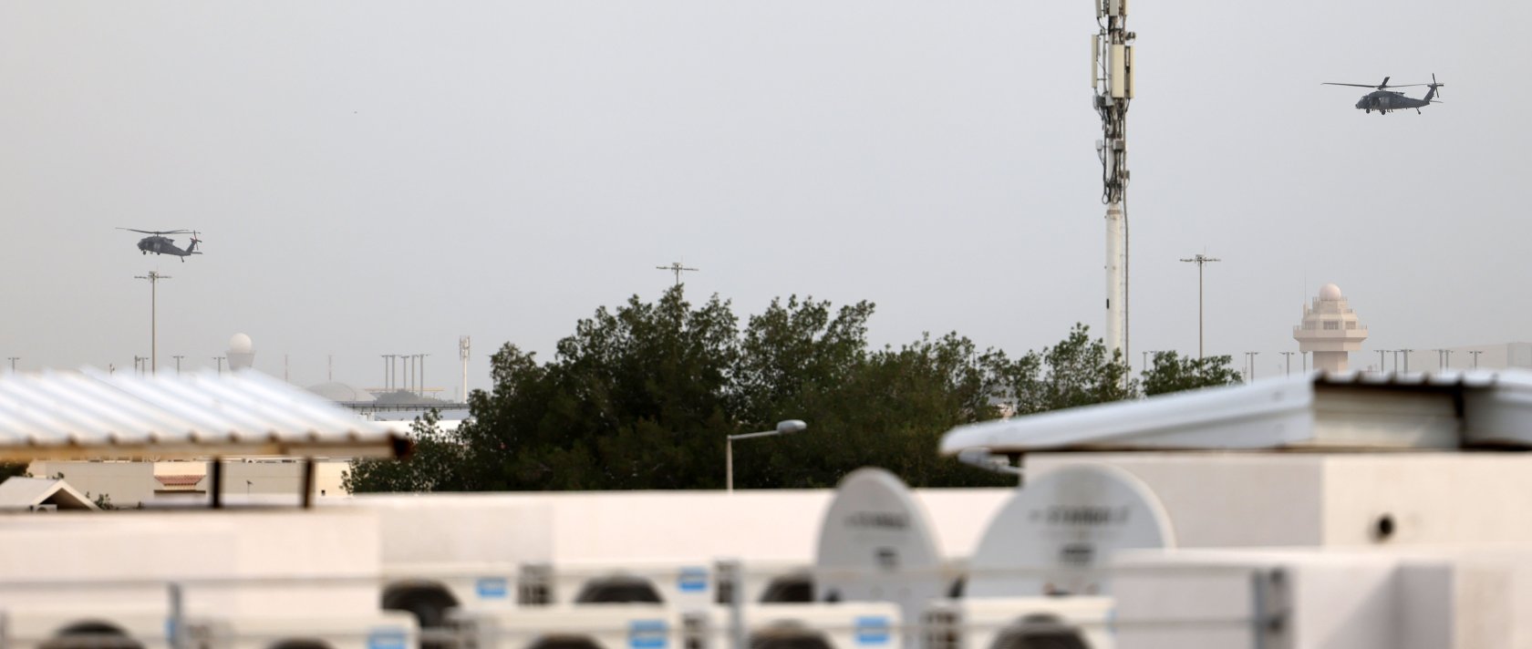 This file photo shows two Qatari Air Force helicopters flying over Doha, Qatar, March 2, 2026. (Getty Images)