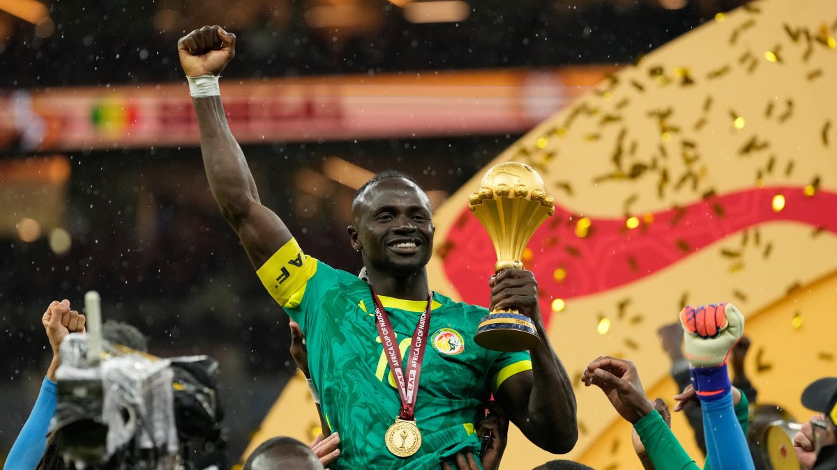 Senegal's Sadio Mane holds the trophy after winning the Africa Cup of Nations final match against Morocco, Rabat, Morocco, Jan. 18, 2026. (AP Photo)