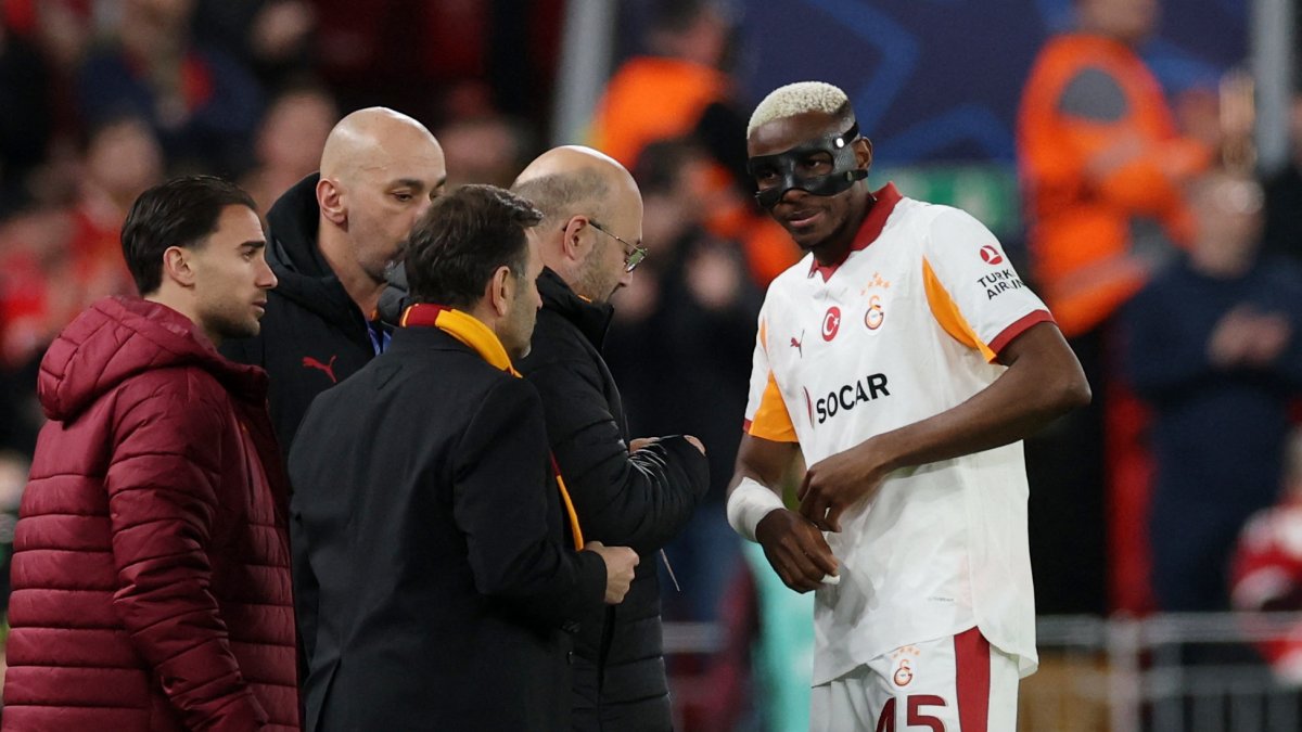 Galatasaray's Victor Osimhen receives medical attention after sustaining an injury during the Champions League round 16 second leg against Liverpool at Anfield, Liverpool, U.K., March 18, 2026. (Reuters Photo)