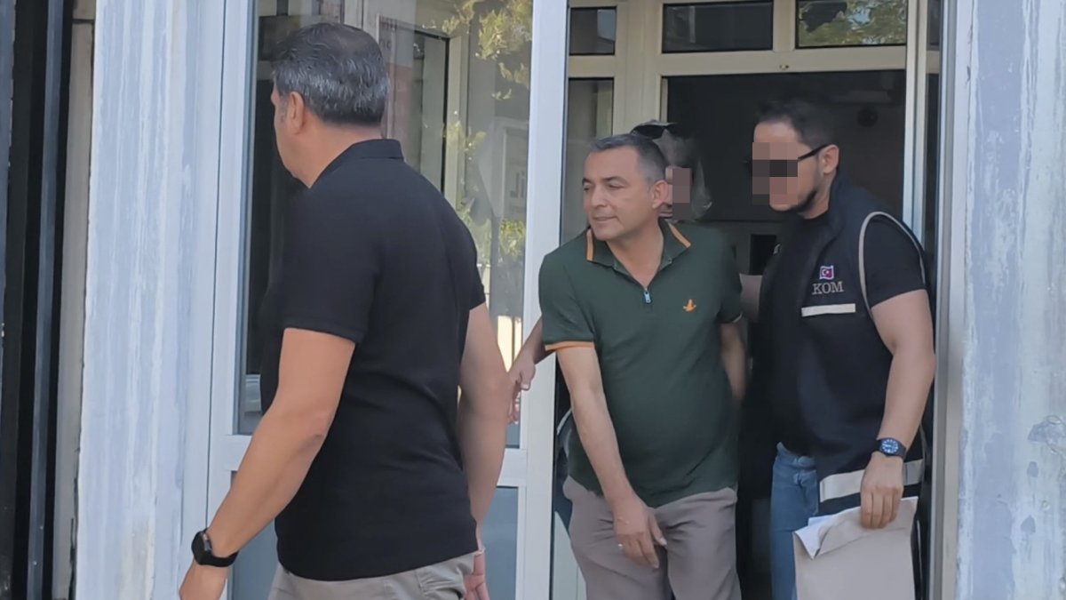 Police officers escort Manavgat Mayor Niyazi Nefi Kara (C) after his detention, Antalya, southern Türkiye, July 4, 2025. (İHA Photo)