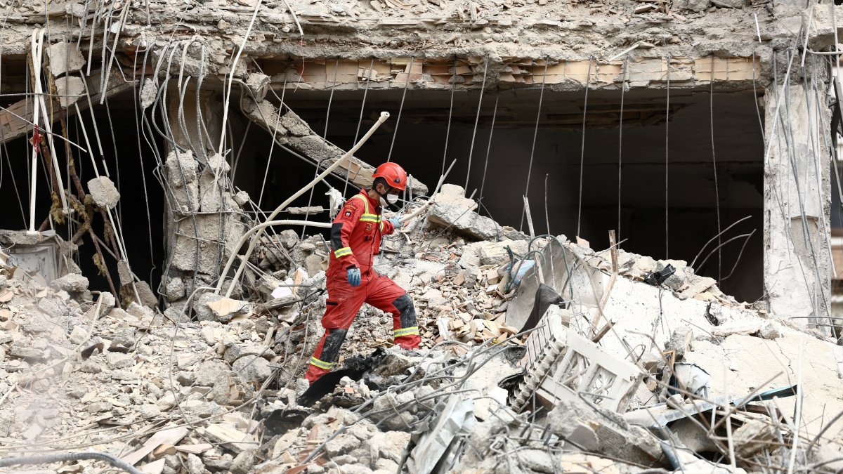 Emergency personnel work at the site of a strike on a residential building, amid the U.S.-Israeli conflict with Iran, in Tehran, Iran, March 23, 2026. (Reuters Photo)