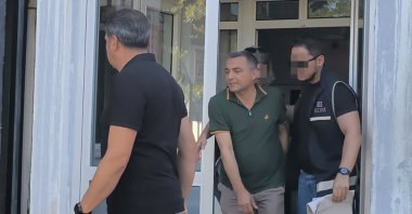 Police officers escort Manavgat Mayor Niyazi Nefi Kara (C) after his detention, Antalya, southern Türkiye, July 4, 2025. (İHA Photo)