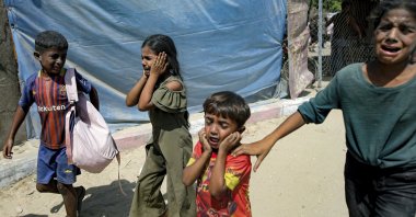 This file photo shows Palestinian children being evacuated from a site targeted by an Israeli bombardment on Khan Younis, southern Gaza Strip, July 13, 2024. (AP Photo)