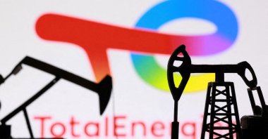 3D-printed oil pump jacks and the TotalEnergies logo appear in this illustration taken March 2, 2026. (Reuters Photo)