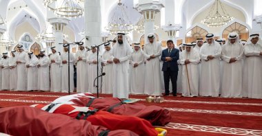 This handout picture released by Qatar's Amiri Diwan on March 22, 2026, shows Qatar's Sheikh Tamim bin Hamad al-Thani perform funeral prayer at Imam Muhammad bin Abdul Wahhab Mosque in Doha for the four servicemen who were killed in a helicopter crash in Qatar's territorial waters. (AFP Photo)