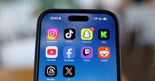 Instagram, TikTok, Snapchat, Kick, YouTube, Facebook, Twitch, Reddit, Threads and X applications are displayed on a mobile phone in this picture illustration, Dec.  9, 2025. (Reuters Photo)