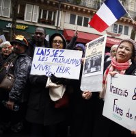 Protestors hold placards during a demonstration against Islamophobia, in Paris, France, Nov. 10, 2019. (AP File Photo)