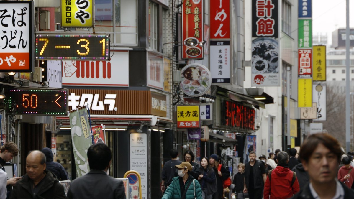 People walk through the Shinjuku shopping district, Tokyo, Japan, Feb. 27, 2026. (EPA Photo)