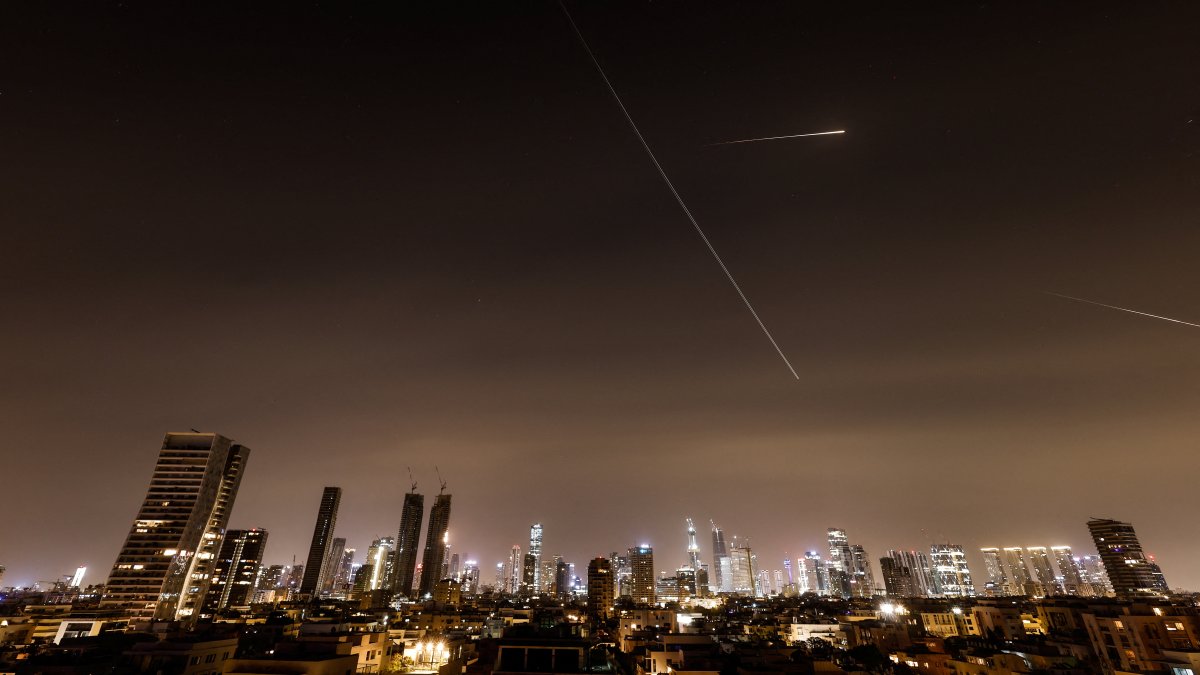 Iranian missiles light up the sky during an interception attempt amid the U.S.-Israeli conflict with Iran, Tel Aviv, Israel, March 21, 2026. (Reuters Photo)