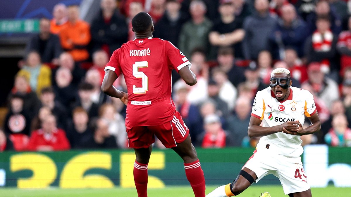 Galatasaray's Victor Osimhen (R) goes down injured during the UEFA Champions League round of 16 2nd-leg match between Liverpool and Galatasaray, Liverpool, U.K., March 18, 2026. (EPA Photo)