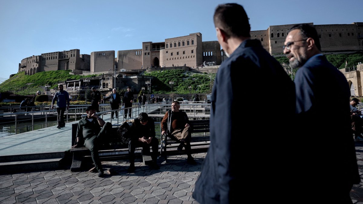 People walk near the citadel in Irbil, the capital of the autonomous Kurdish region in northern Iraq, March 18, 2026. (AFP Photo)