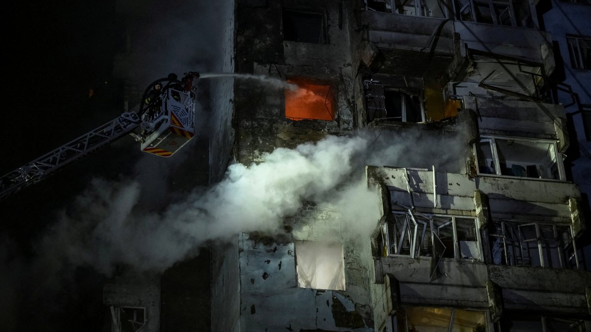 Firefighters work at the site of an apartment building hit by a Russian drone strike in Zaporizhzhia, Ukraine, March 24, 2026. (Reuters Photo)