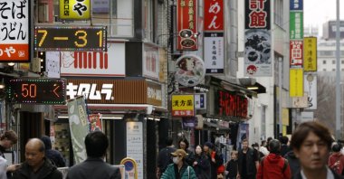 People walk through the Shinjuku shopping district, Tokyo, Japan, Feb. 27, 2026. (EPA Photo)