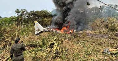 A military personnel makes a video of the crash site in the province of Putumayo, Colombia, March 23, 2026. (DHA Photo)