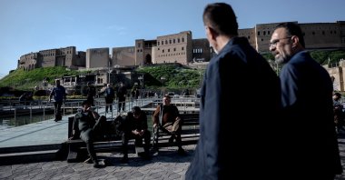 People walk near the citadel in Irbil, the capital of the autonomous Kurdish region in northern Iraq, March 18, 2026. (AFP Photo)