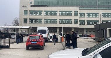 Police vehicles arrive at the courthouse in Bolu as 13 suspects, including Mayor Tanju Özcan, are brought in for questioning in a corruption probe, northwestern Bolu province, Türkiye, March 2, 2026. (AA Photo)