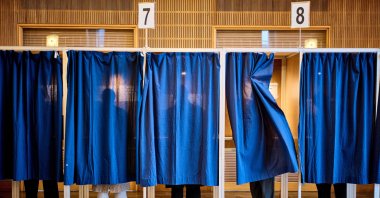 People cast their votes at a polling station at Aarhus City Hall, during the parliamentary election in Denmark, March 24, 2026. (AFP Photo)