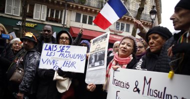 Protestors hold placards during a demonstration against Islamophobia, in Paris, France, Nov. 10, 2019. (AP File Photo)