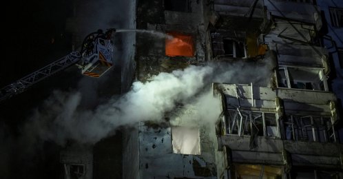Firefighters work at the site of an apartment building hit by a Russian drone strike in Zaporizhzhia, Ukraine, March 24, 2026. (Reuters Photo)
