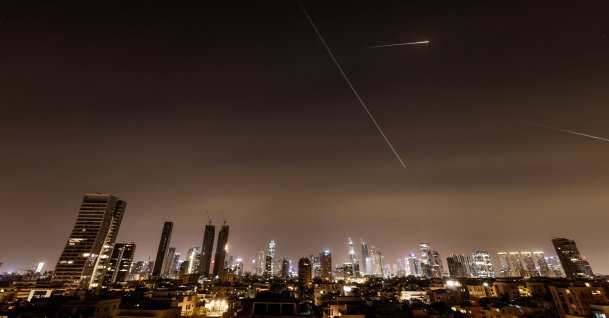 Iranian missiles light up the sky during an interception attempt amid the U.S.-Israeli conflict with Iran, Tel Aviv, Israel, March 21, 2026. (Reuters Photo)