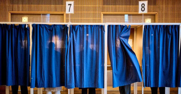 People cast their votes at a polling station at Aarhus City Hall, during the parliamentary election in Denmark, March 24, 2026. (AFP Photo)