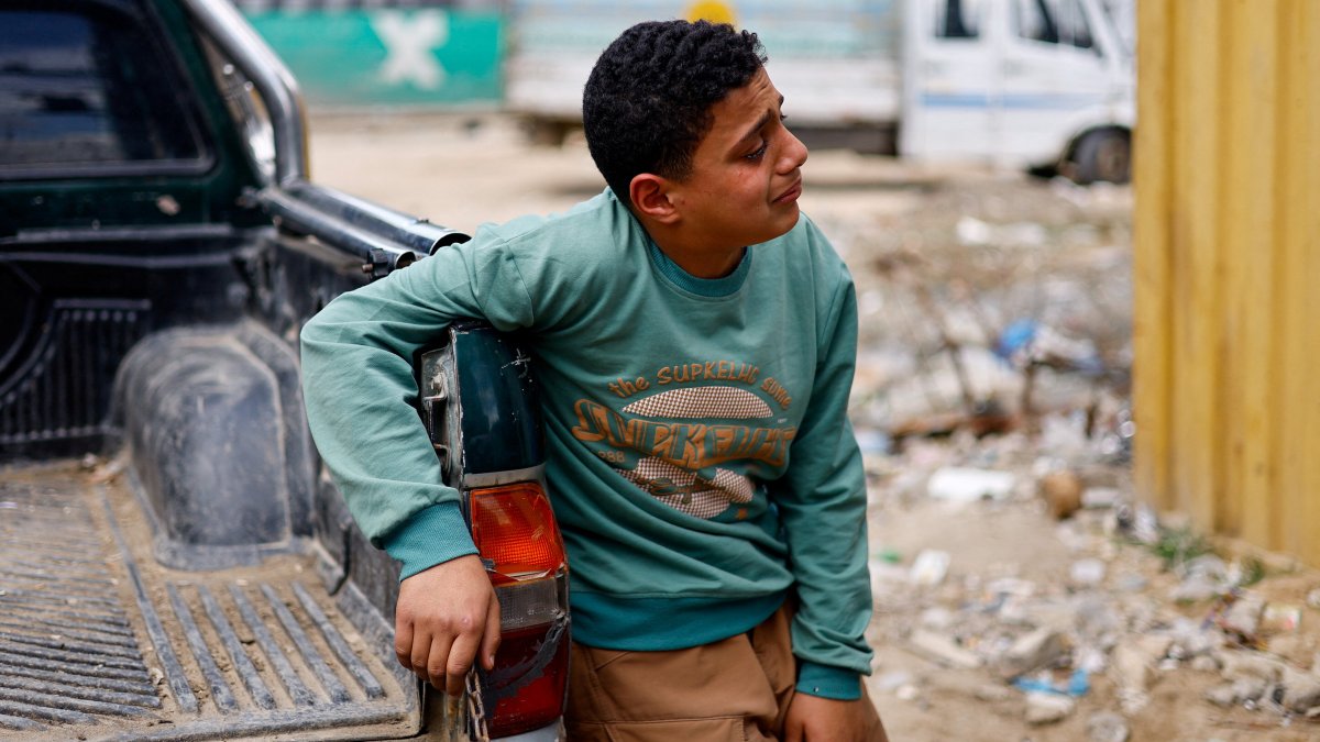 A mourner reacts during the funeral of Palestinians killed in an Israeli strike, in Nuseirat, central Gaza Strip, March 25, 2026. (Reuters Photo)