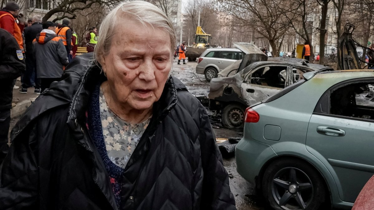 A resident walks at the site of a Russian drone strike, amid Russia's attack on Ukraine, in Kharkiv, Ukraine, March 25, 2026. (Reuters Photo)