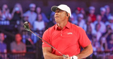 Tiger Woods of the Jupiter Links Golf Club plays his shot from the first tee during final day of TGL golf tournament, Palm Beach Gardens, U.S., March 24, 2026. (AP Photo)