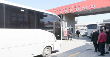 A police transport bus carrying suspects arrives at the Forensic Medicine Institute for medical examinations, Istanbul, Türkiye, March 25, 2026. (DHA Photo) 