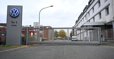 The logo of Europe’s largest carmaker Volkswagen AG is seen at the closed Gate 1 of the Volkswagen Osnabrueck plant during a briefing of the Works Council about VW's plans to close down three plants and lay off thousands of employees in Osnabrueck, Germany, Oct. 28, 2024. (Reuters File Photo)