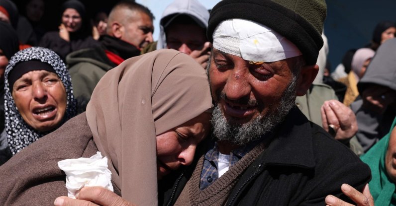 Mohammed Shannaran mourn over the body of his son Ameer Shannaran with family at his funeral in Yatta village in Hebron, occupied West Bank, Palestine, March 8, 2026. (AFP Photo)
