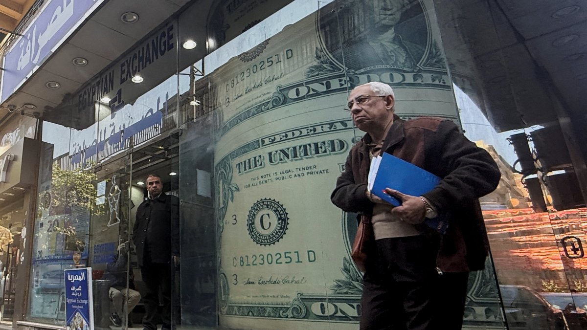 An Egyptian man walks past a currency exchange, Cairo, Egypt, March 9, 2026. (Reuters Photo)