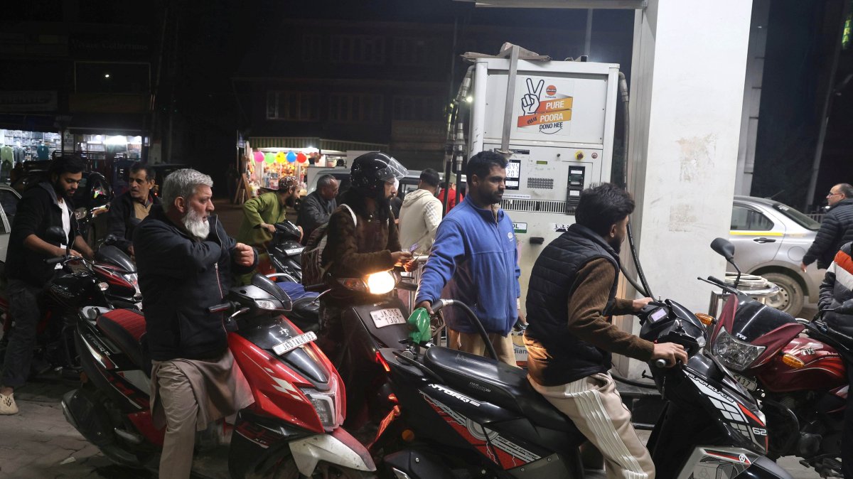 Motorcyclists wait to fetch fuel at a petrol pump in Srinagar, Kashmir, India, March 25, 2026. (EPA Photo)