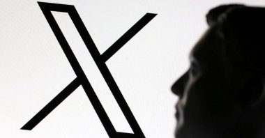 A 3D-printed miniature model of Elon Musk and the X logo is seen in this illustration taken on Jan. 23, 2025. (Reuters Photo)