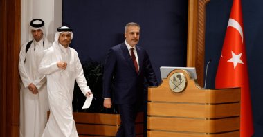 Foreign Minister Hakan Fidan (R) and Qatari Prime Minister and Foreign Minister Sheikh Mohammed bin Abdulrahman Al Thani (2nd L) arrive to address a joint press conference, Doha, Qatar, March 19, 2026. (AFP Photo)