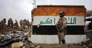 Iraqi soldiers inspect the site of a destroyed health care center in the Habbaniyah military base, which was targeted by an airstrike, Habbaniyah, Iraq, March 26, 2026. (AFP Photo)