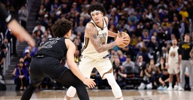 Golden State Warriors' Gui Santos (R) looks for an opening against Brooklyn Nets' Jalen Wilson during the second half at Chase Center, San Francisco, U.S., March 25, 2026. (AFP Photo)