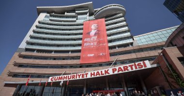 Journalists wait outside the headquarters of the CHP, Ankara, Türkiye, Sept. 15, 2025. (AFP Photo)