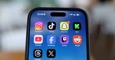 Instagram, TikTok, Snapchat, Kick, YouTube, Facebook, Twitch, Reddit, Threads and X applications are displayed on a mobile phone ahead of new law banning social media for users under 16 in Australia, in this picture illustration taken, Dec. 9, 2025. (Reuters File Photo)
