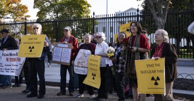 People protest against nuclear weapons outside the White House fence in Washington, D.C., Nov.  2, 2025. (NurPhoto via AFP, File) 