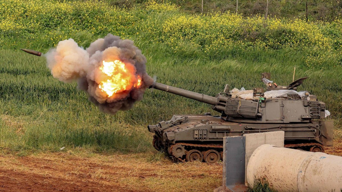 An Israeli self-propelled howitzer artillery gun fires rounds toward southern Lebanon from a position in the upper Galilee, northern Israel, March 26, 2026. (AFP Photo)